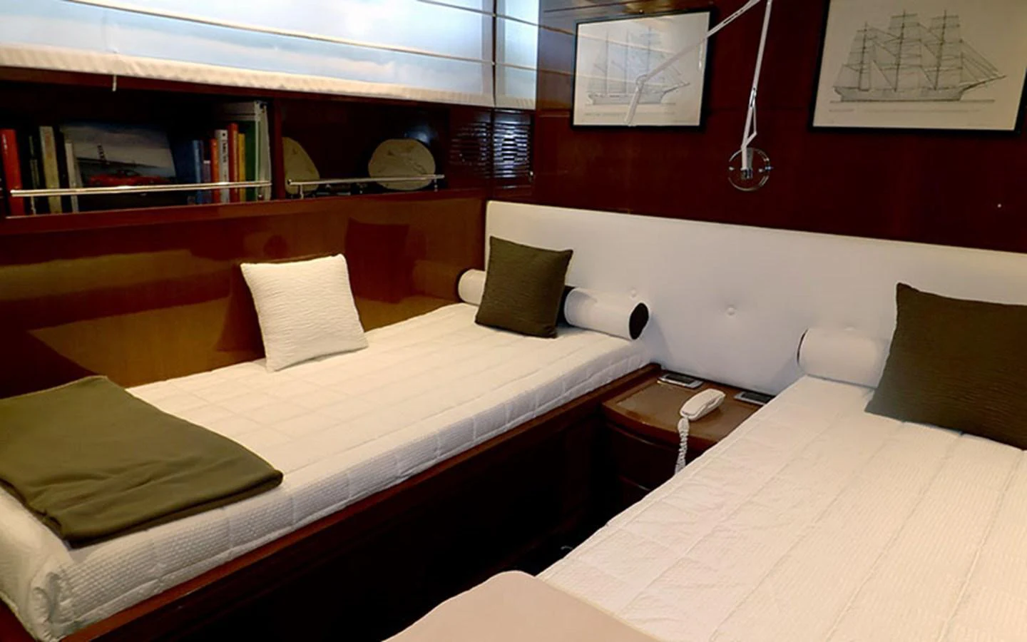 The twin stateroom features two single beds with elegant bedding and tasteful decor. aboard MEP TOGETHER Yacht for Sale