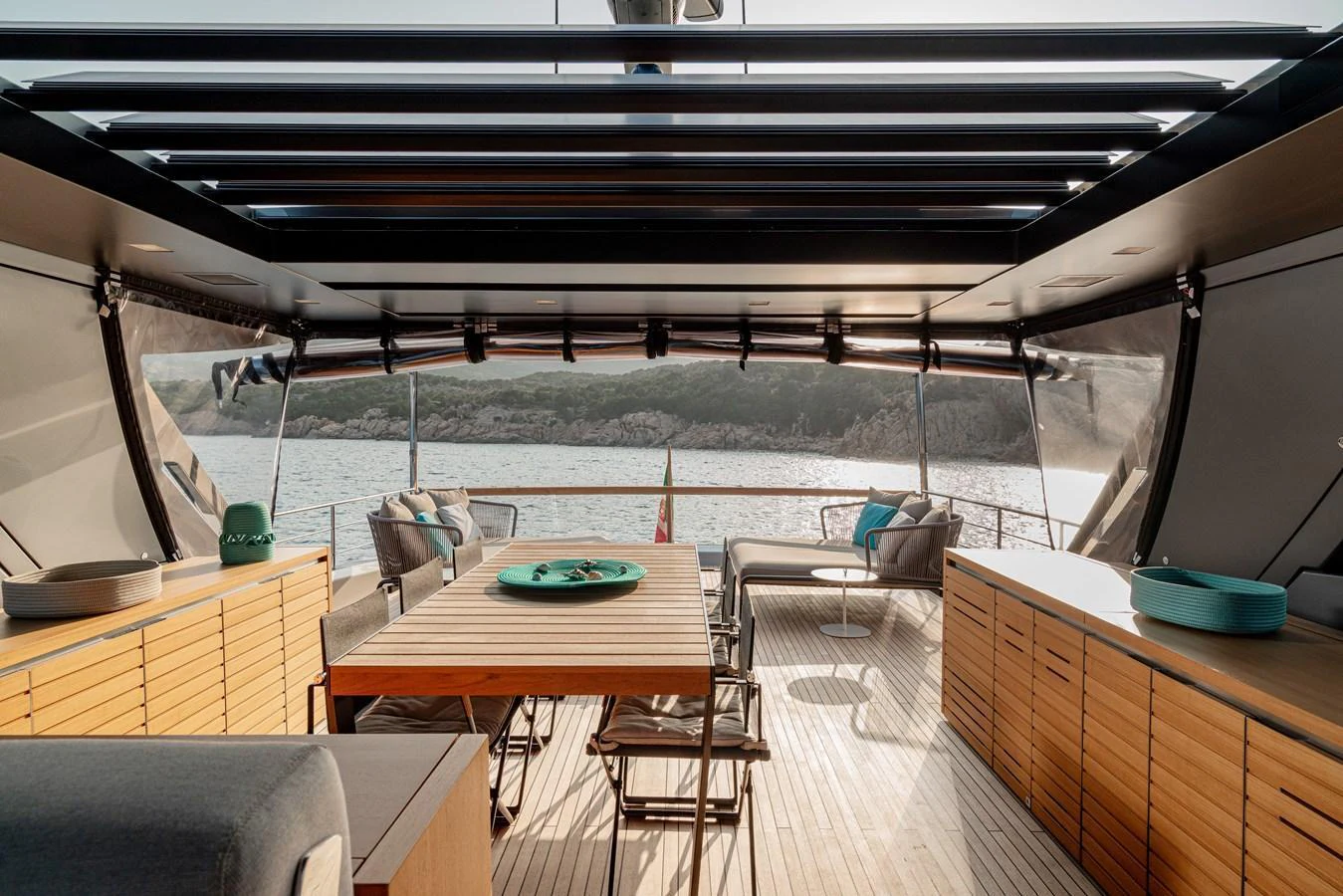 The aft deck features a spacious dining area with comfortable seating and stunning views of the water. aboard SANLORENZO SX 88 M&M Yacht for Sale