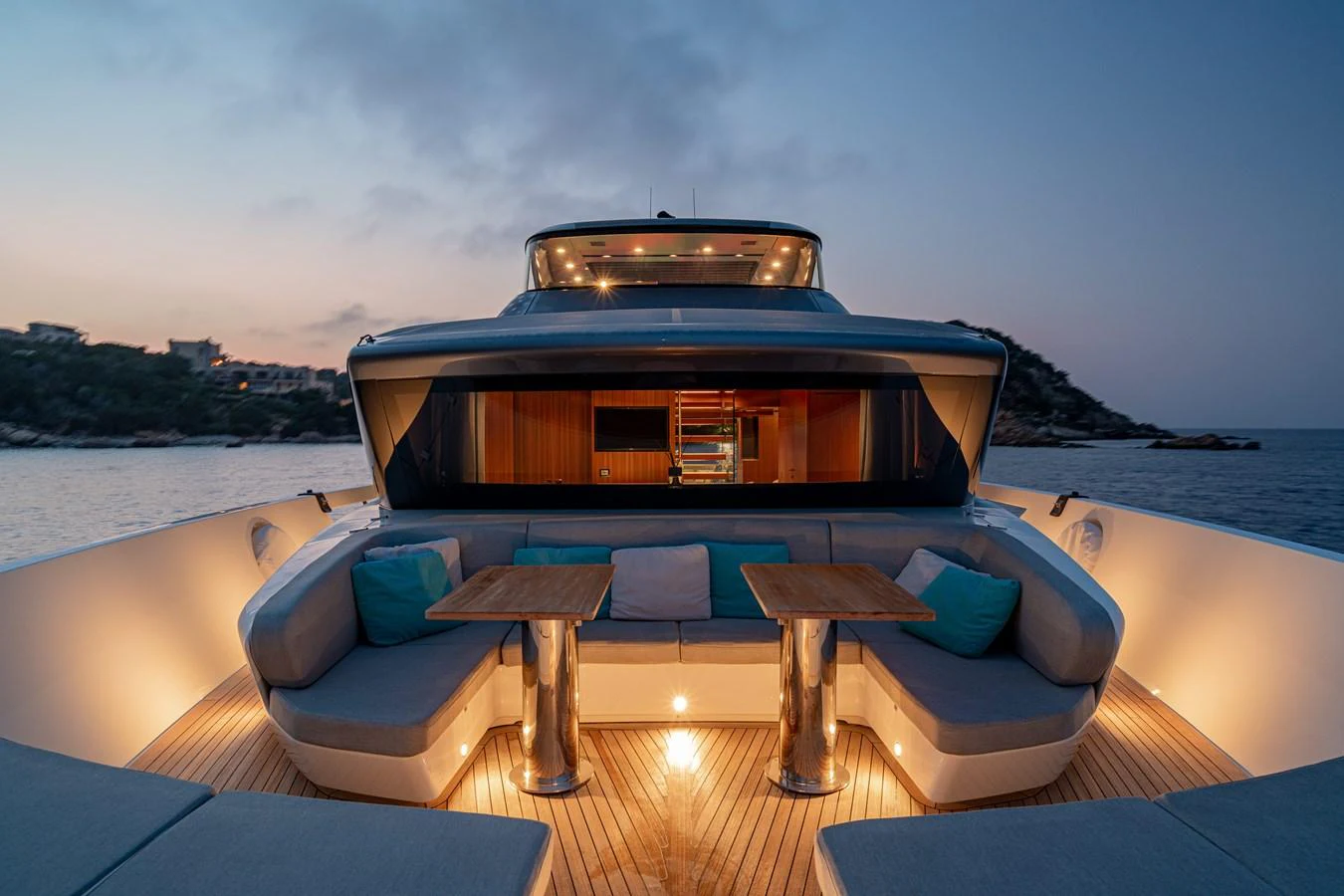 The yacht's aft deck features a stylish seating area with elegant lighting, perfect for evening relaxation. aboard SANLORENZO SX 88 M&M Yacht for Sale