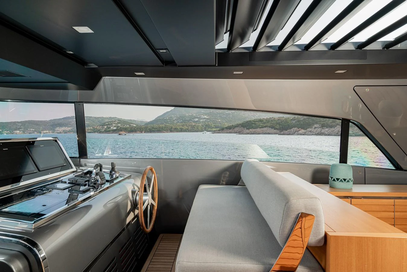 The helm area offers a sleek, modern design with panoramic views of the surrounding waters. aboard SANLORENZO SX 88 M&M Yacht for Sale
