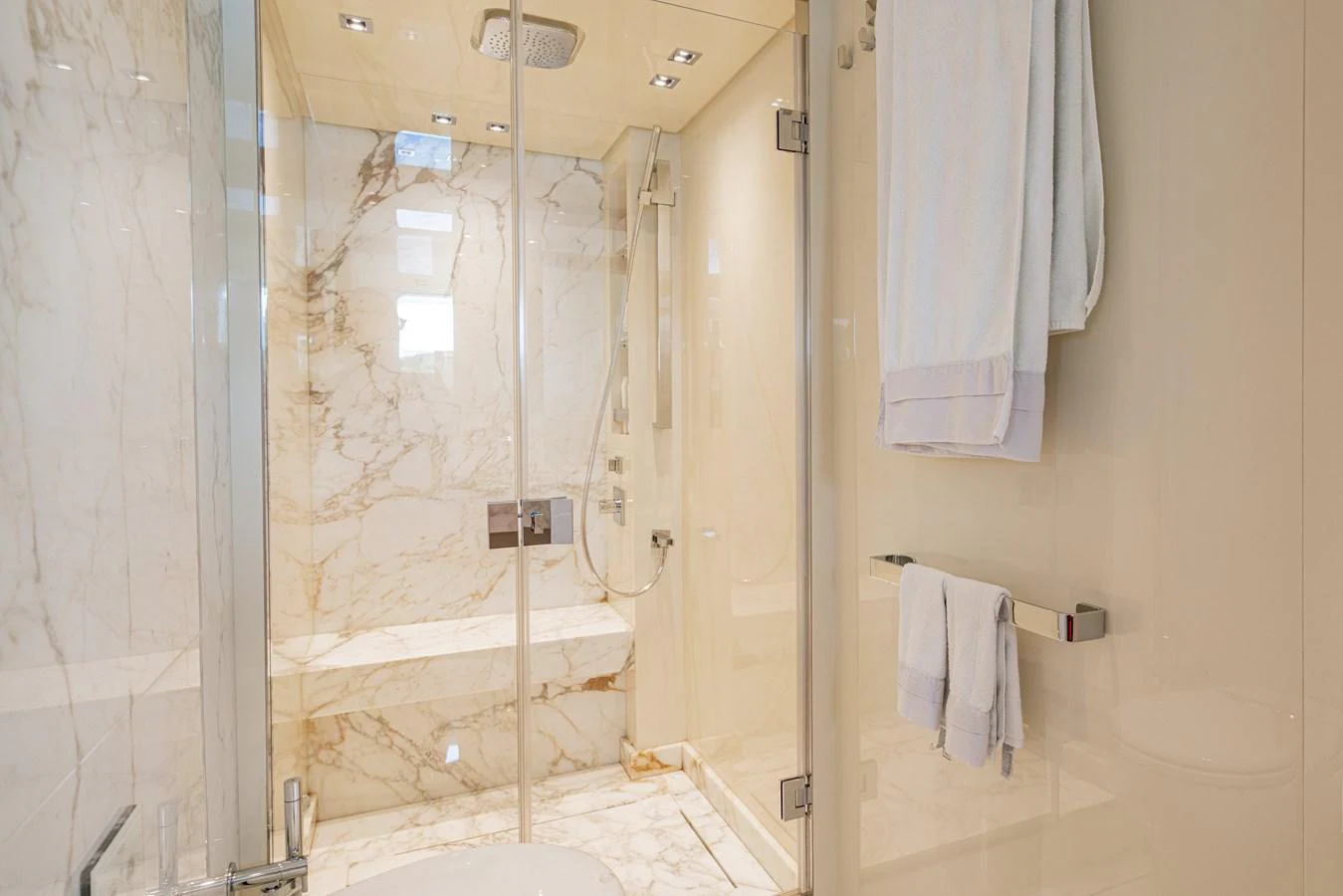 The yacht's bathroom features luxurious marble finishes and modern fixtures. aboard SANLORENZO SX 88 M&M Yacht for Sale