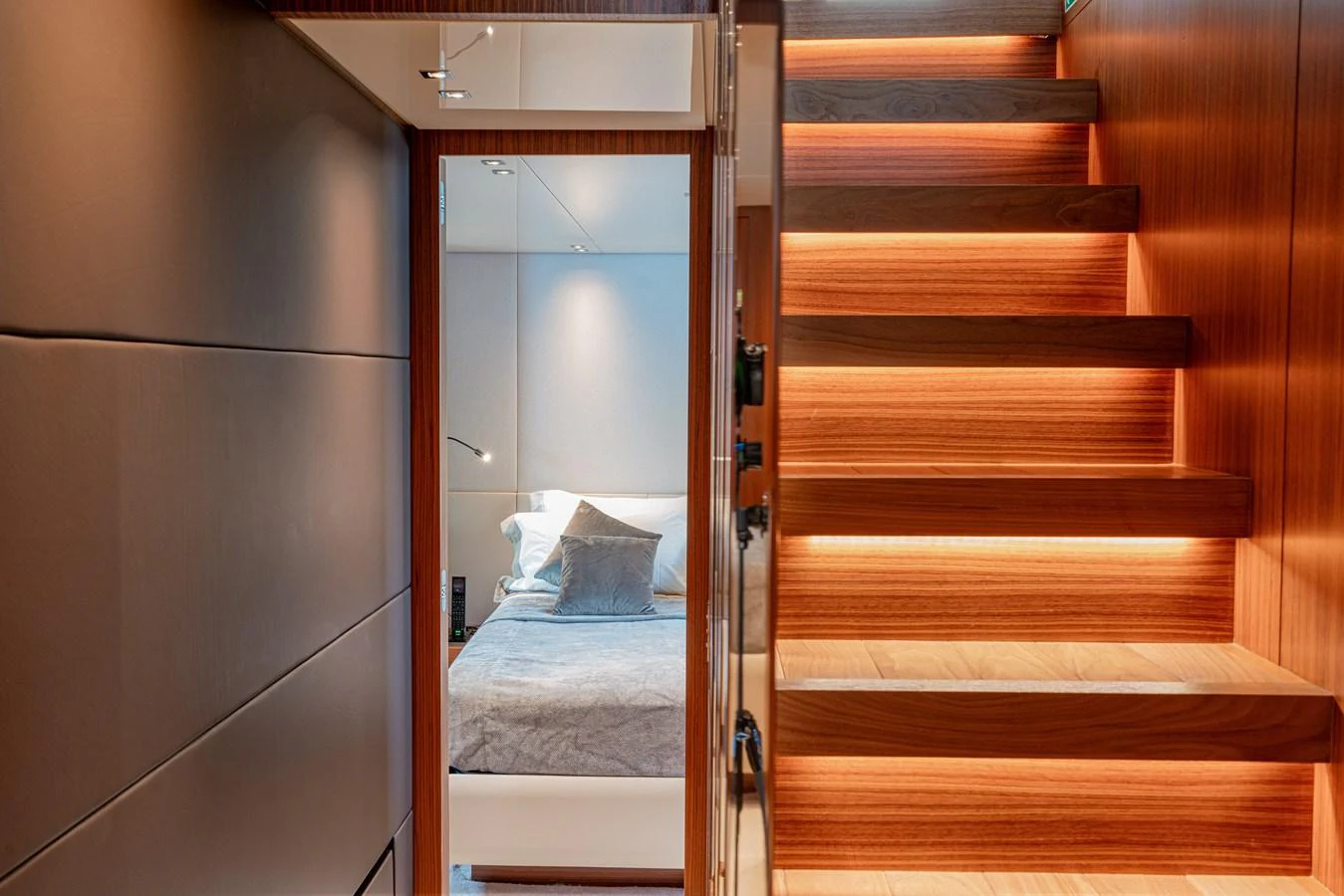 A luxurious interior view featuring a well-lit staircase leading to a cozy cabin. aboard SANLORENZO SX 88 M&M Yacht for Sale