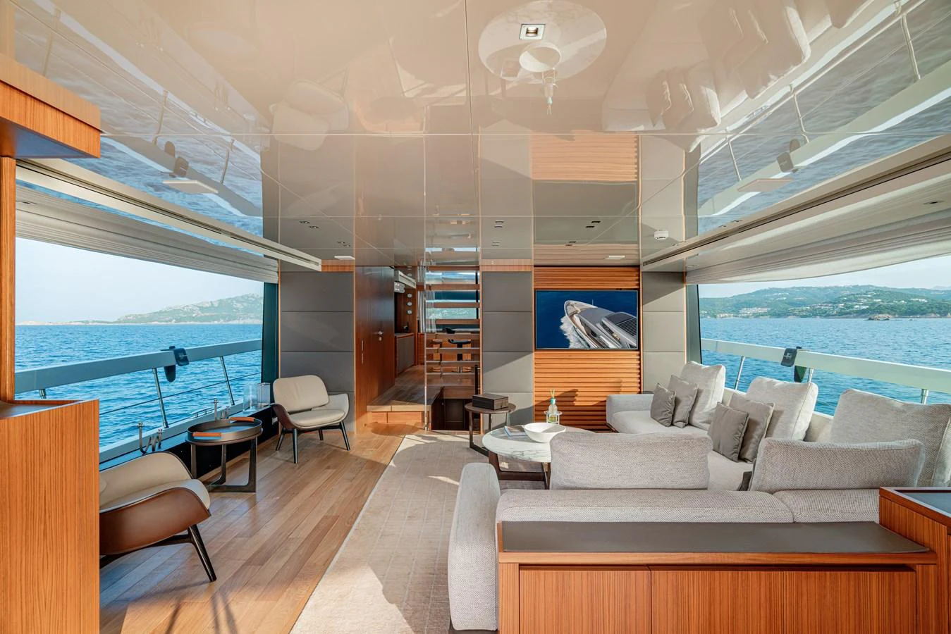 The salon offers a luxurious and spacious area with modern furnishings and panoramic views of the sea. aboard SANLORENZO SX 88 M&M Yacht for Sale