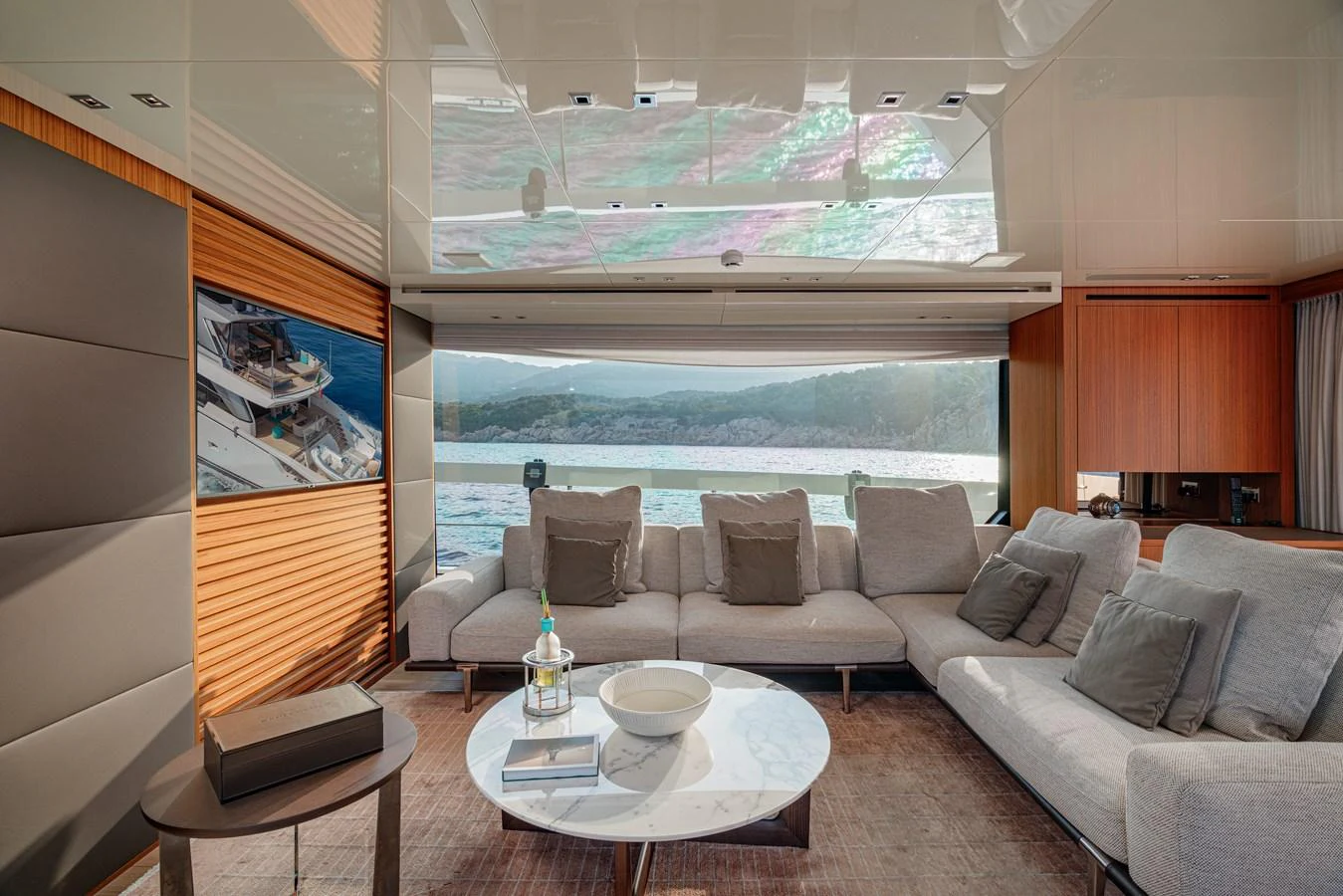 The salon features a spacious and elegant seating area with panoramic views of the sea. aboard SANLORENZO SX 88 M&M Yacht for Sale