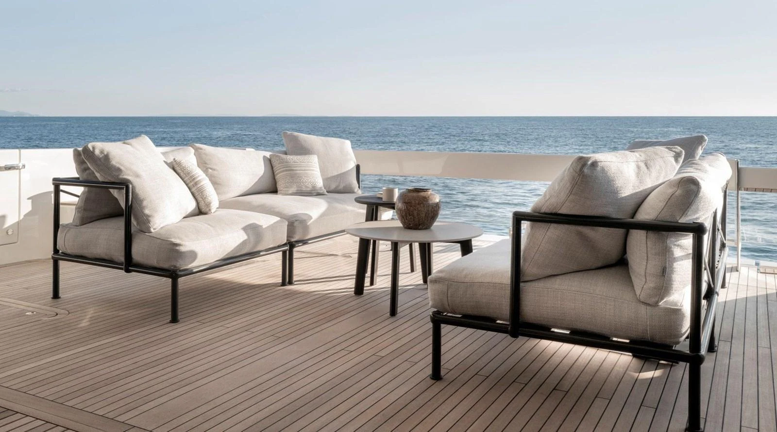 The aft deck features elegant outdoor seating with a stunning ocean view. aboard TELL NO ONE Yacht for Sale
