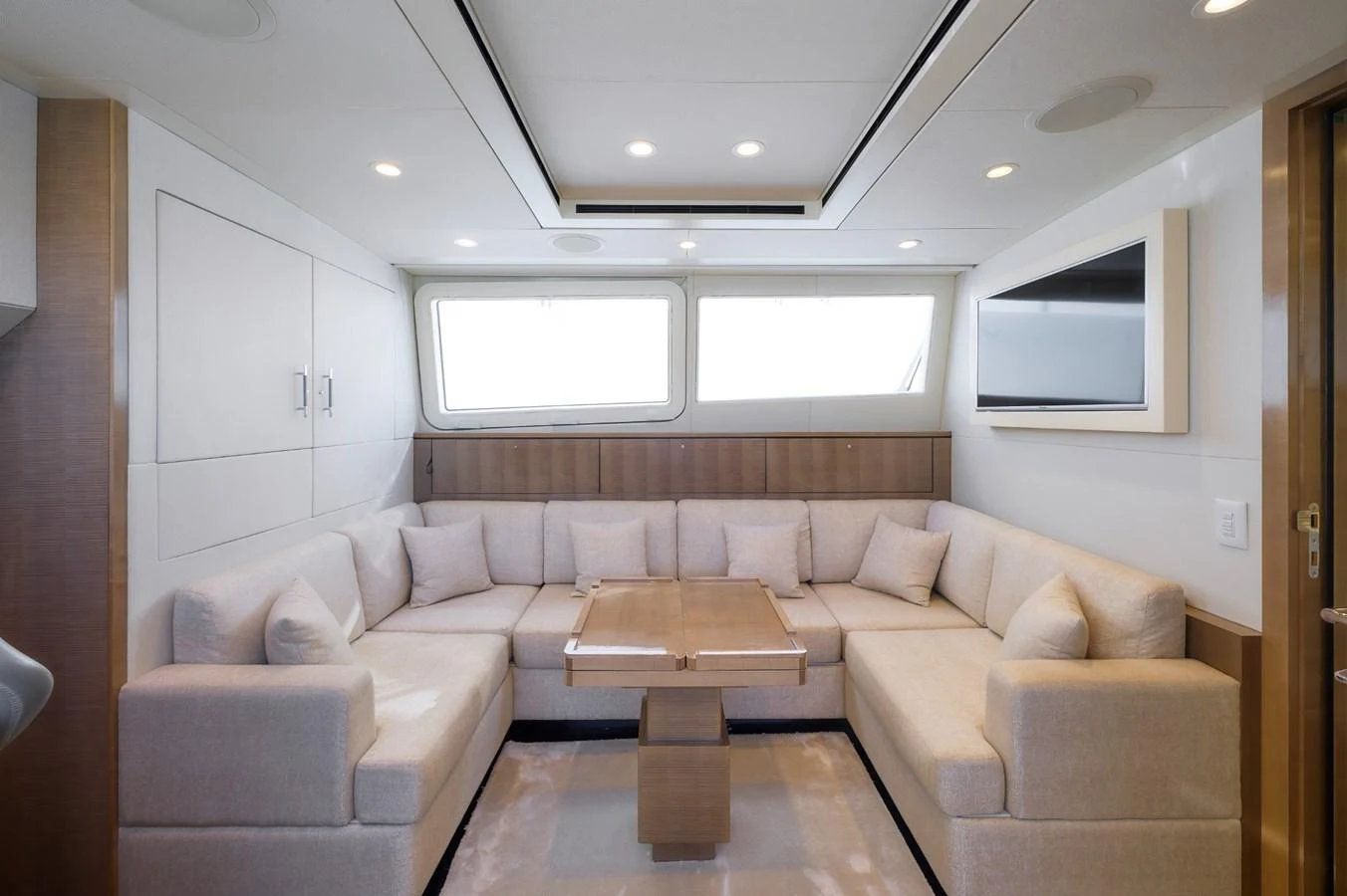 The salon features a spacious and elegant seating area with plush cushions and ample natural light. aboard ZARKAVA Yacht for Sale