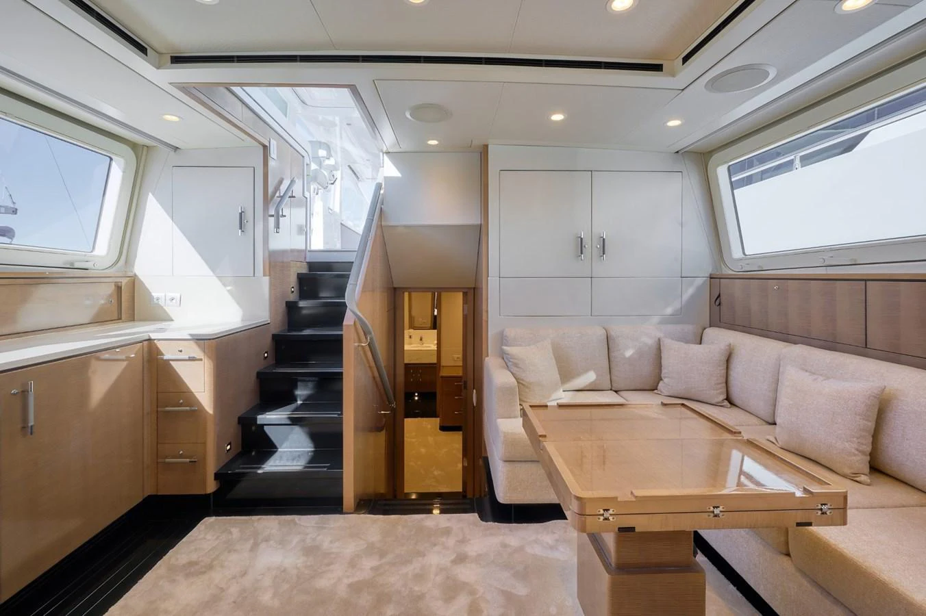 The salon features a comfortable seating area with a modern design and ample natural light. aboard ZARKAVA Yacht for Sale