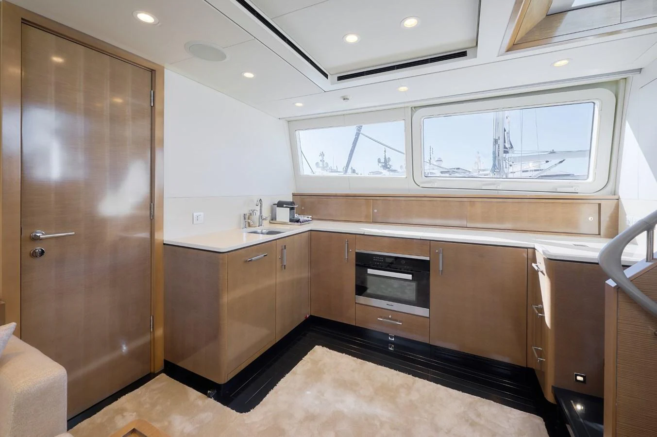 The yacht's galley is modern and well-equipped, featuring sleek cabinetry and ample counter space. aboard ZARKAVA Yacht for Sale