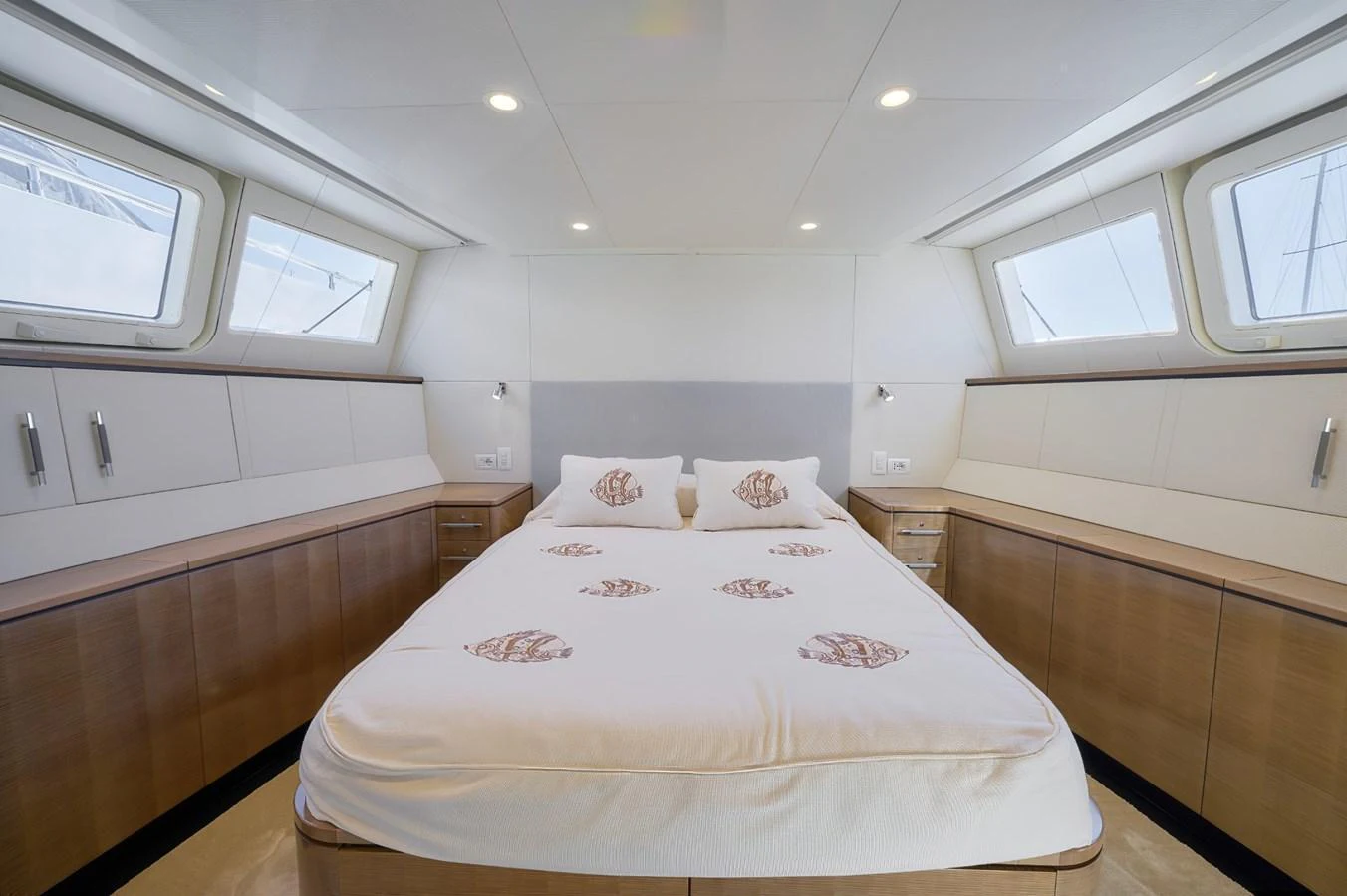A serene and spacious stateroom with a large bed and ample natural light. aboard ZARKAVA Yacht for Sale