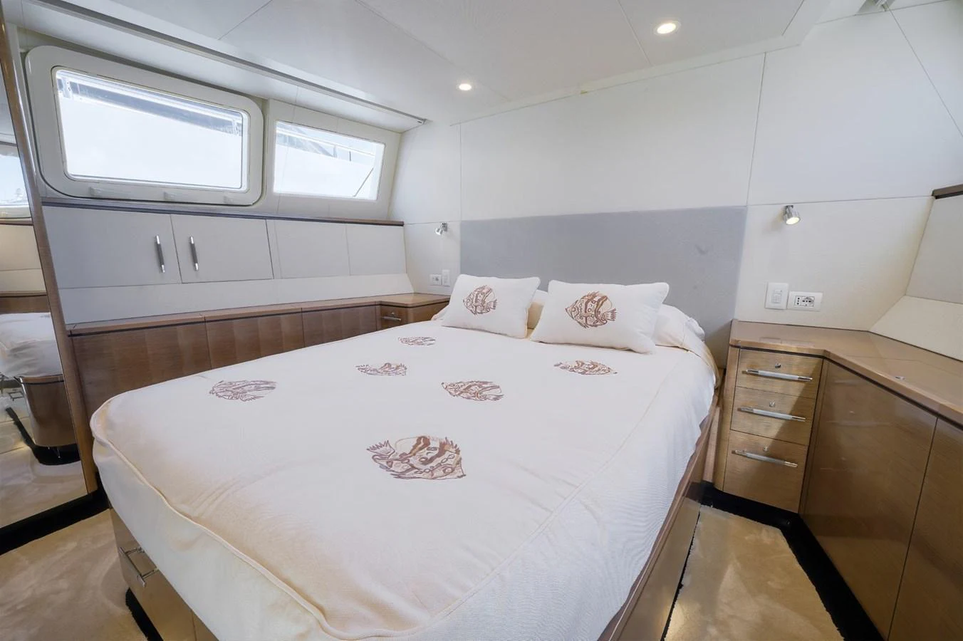 The stateroom features a cozy bed with elegant bedding and ample storage space. aboard ZARKAVA Yacht for Sale