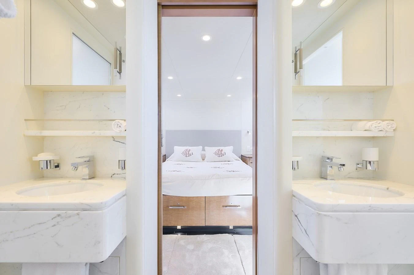 A luxurious stateroom with a double bed and dual sinks, showcasing modern design and comfort. aboard ZARKAVA Yacht for Sale