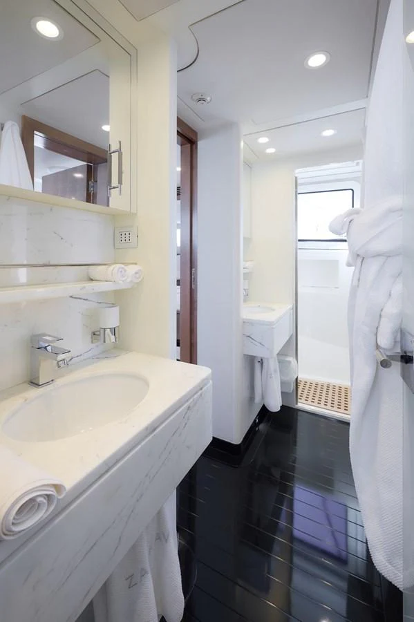 The yacht's bathroom features sleek, modern fixtures and a bright, clean design. aboard ZARKAVA Yacht for Sale