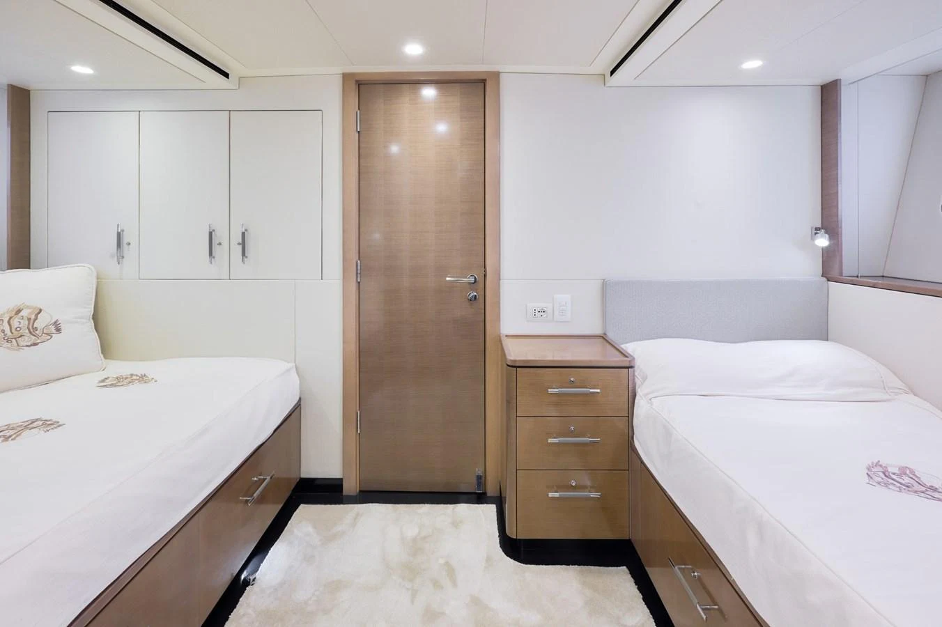 The guest cabin features twin beds, ample storage, and a clean, modern design. aboard ZARKAVA Yacht for Sale