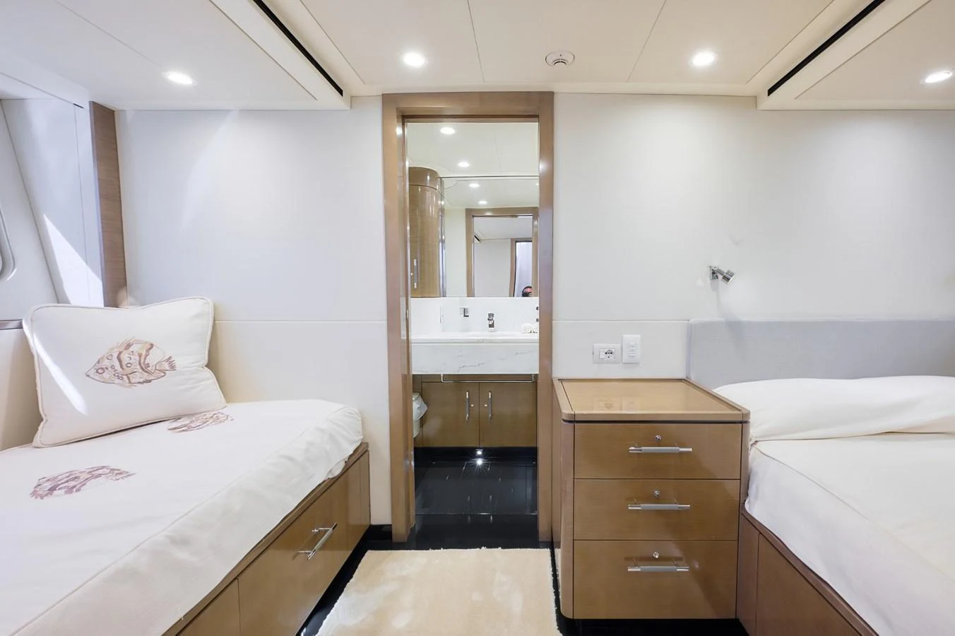 The guest stateroom features twin beds and an en-suite bathroom with modern fixtures. aboard ZARKAVA Yacht for Sale