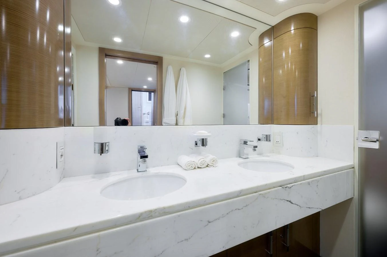 The yacht's bathroom features a sleek, modern design with dual sinks and elegant fixtures. aboard ZARKAVA Yacht for Sale