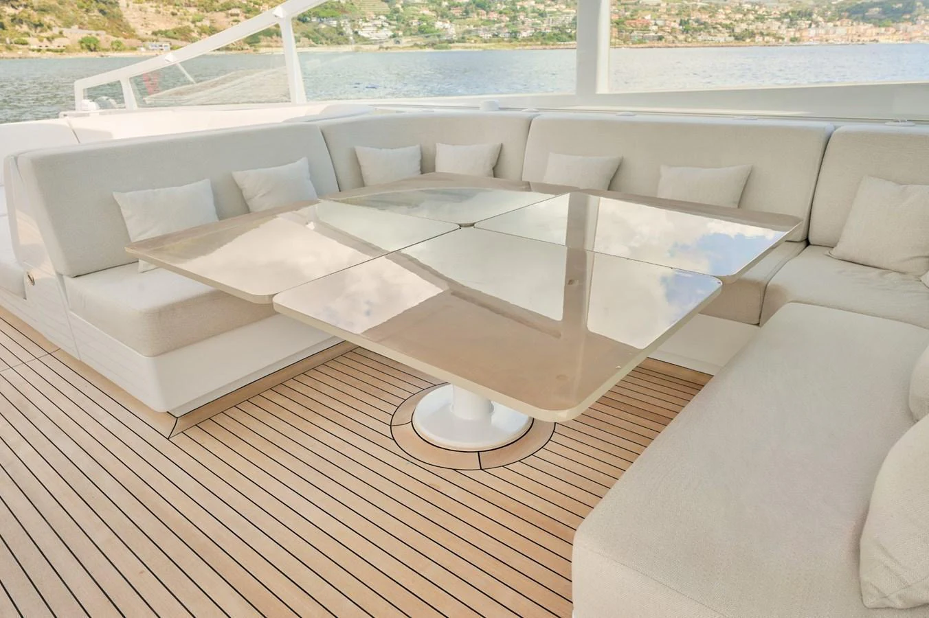 The aft deck features a spacious and elegant seating area with a sleek table, perfect for outdoor relaxation and dining. aboard ZARKAVA Yacht for Sale