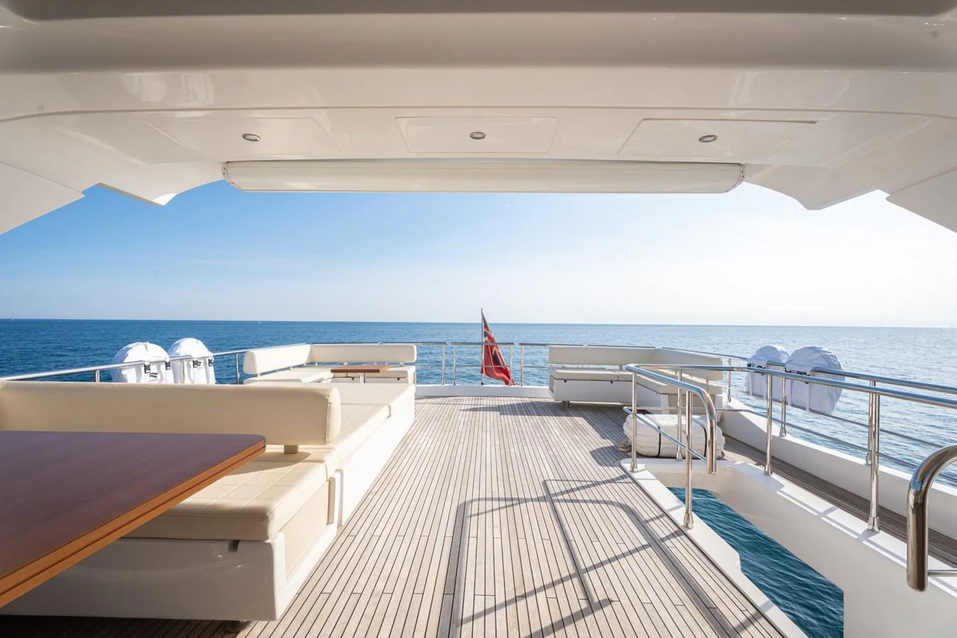 The aft deck offers a spacious and inviting area for relaxation with stunning ocean views. aboard TRINIDAD Yacht for Sale