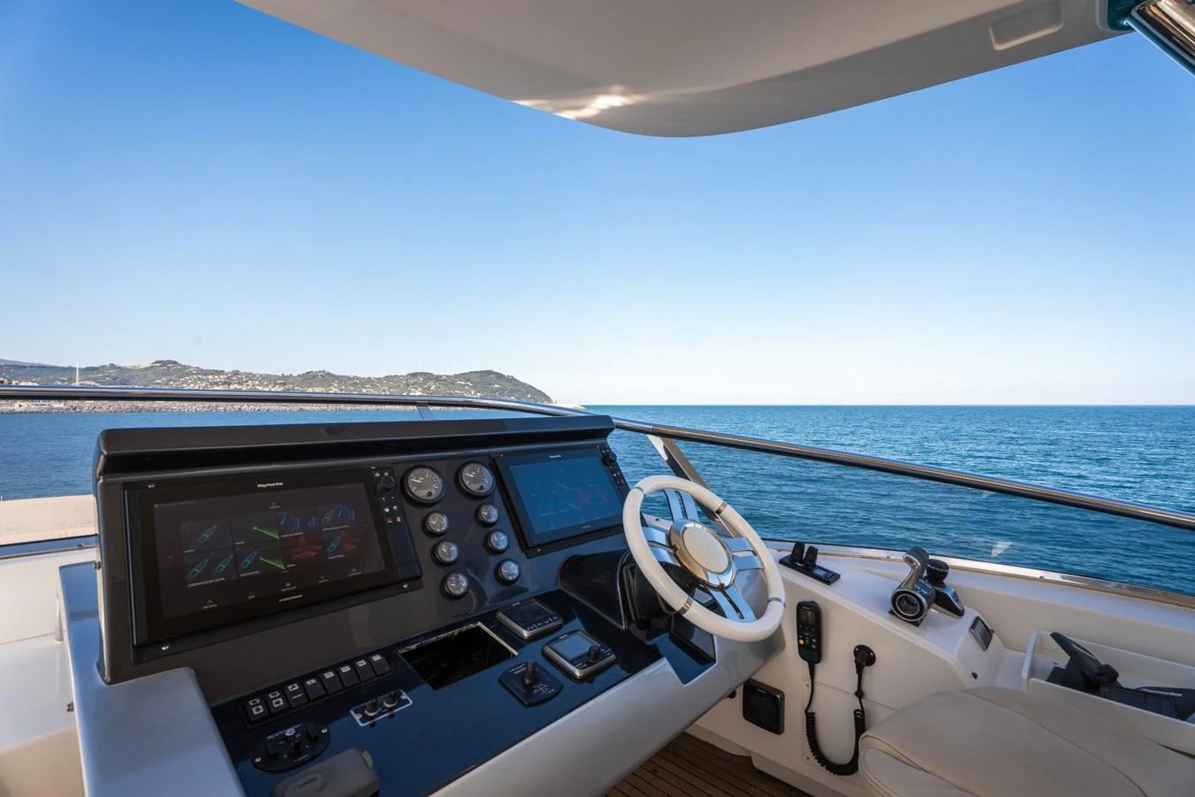 The helm station offers advanced navigation equipment with a panoramic sea view. aboard TRINIDAD Yacht for Sale
