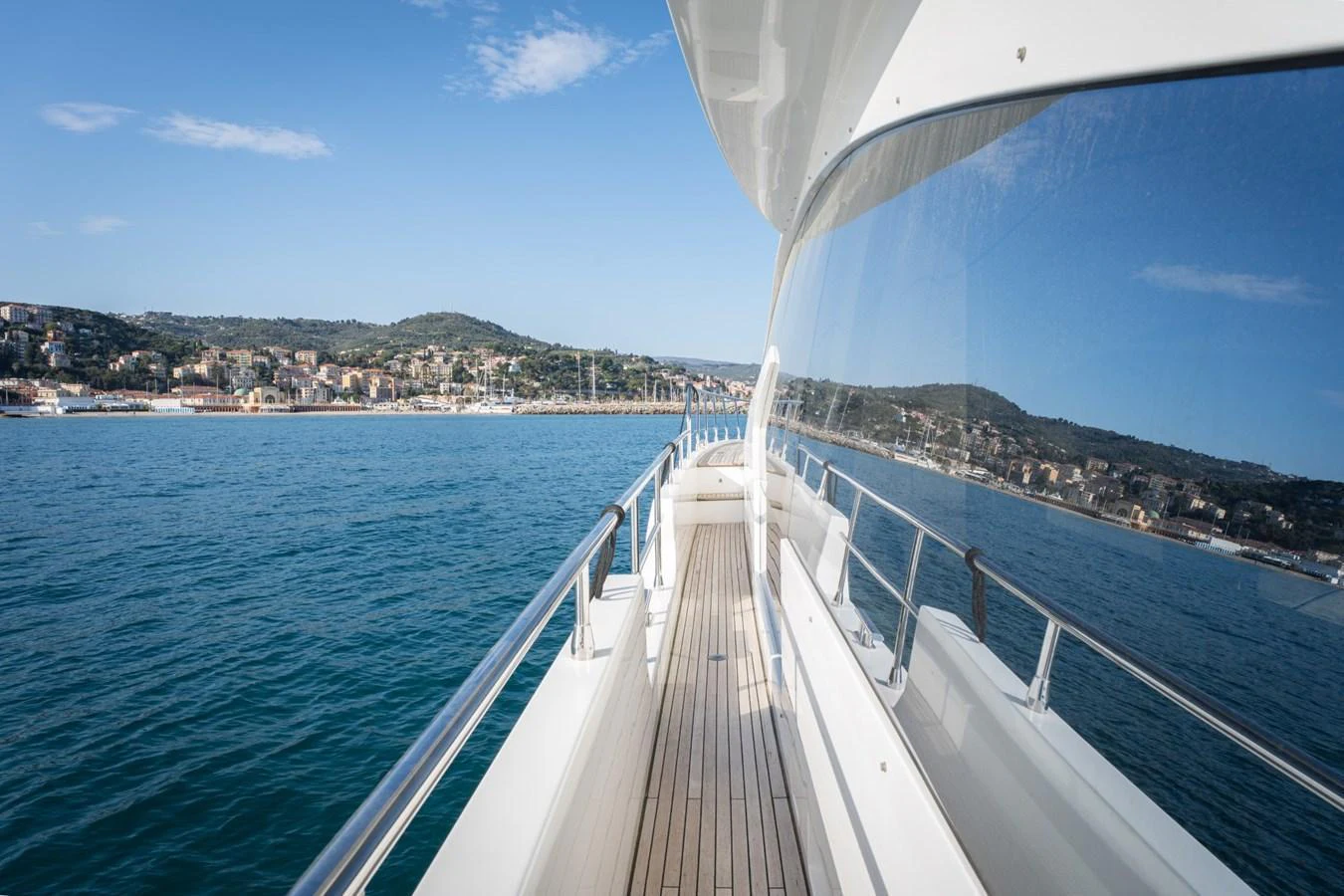 The yacht's sleek side deck offers stunning views of the coastline and open water. aboard TRINIDAD Yacht for Sale