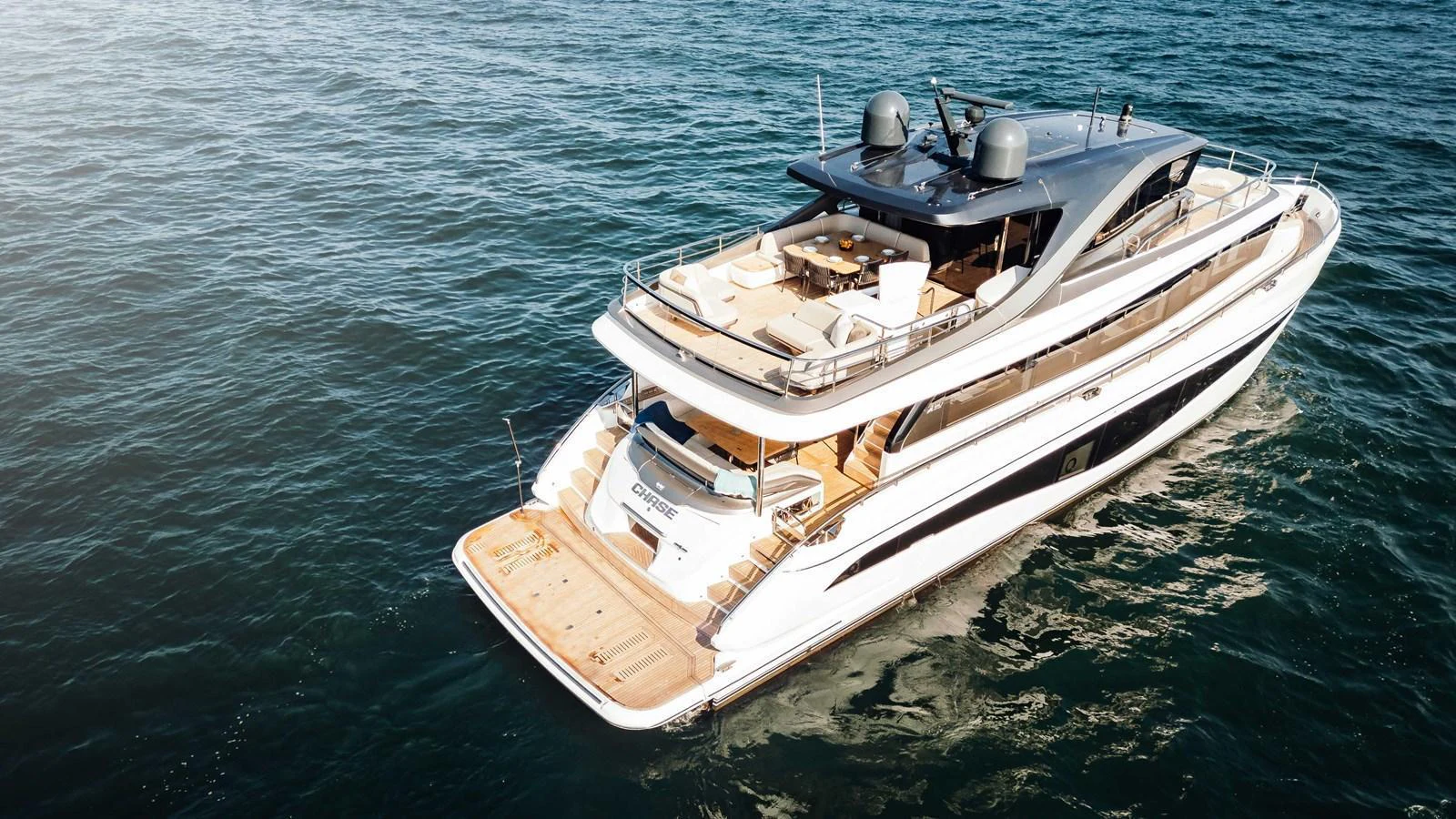 A luxurious yacht cruises on the open water, showcasing its elegant design and spacious decks. aboard CHASE Yacht for Sale