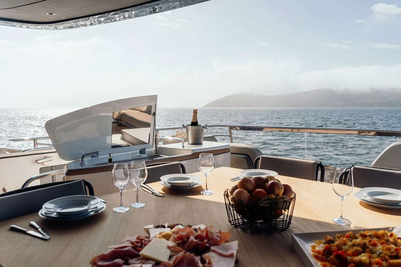 The aft deck offers a luxurious dining experience with a stunning ocean view. aboard CHASE Yacht for Sale