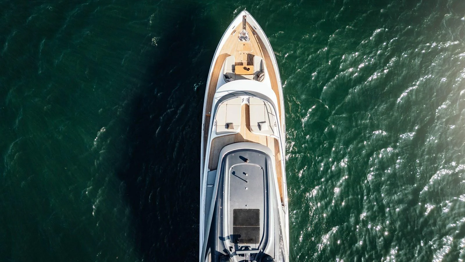 Aerial view of a sleek yacht cruising through the water. aboard CHASE Yacht for Sale