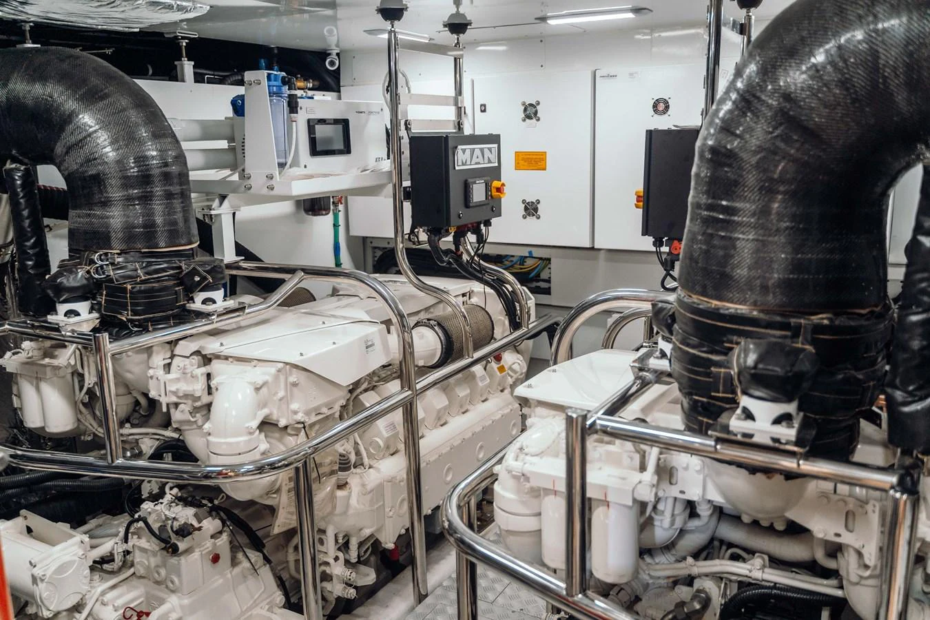 The engine room showcases powerful and well-maintained machinery, highlighting the yacht's impressive engineering. aboard CHASE Yacht for Sale