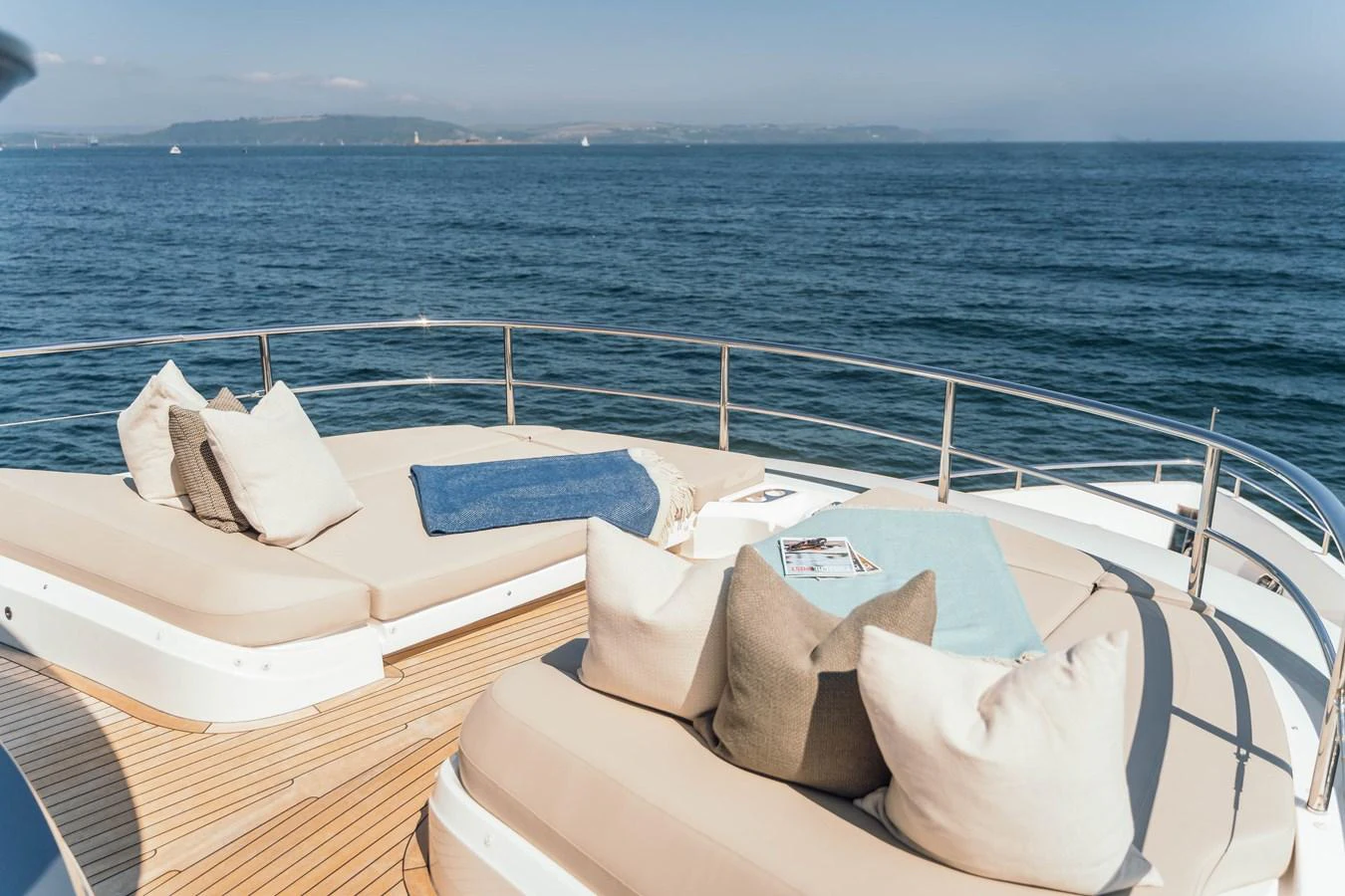 The sundeck offers luxurious lounging with plush cushions and stunning ocean views. aboard CHASE Yacht for Sale