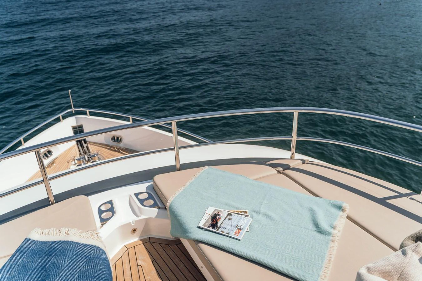 The foredeck features comfortable sun pads with a serene view of the open water. aboard CHASE Yacht for Sale