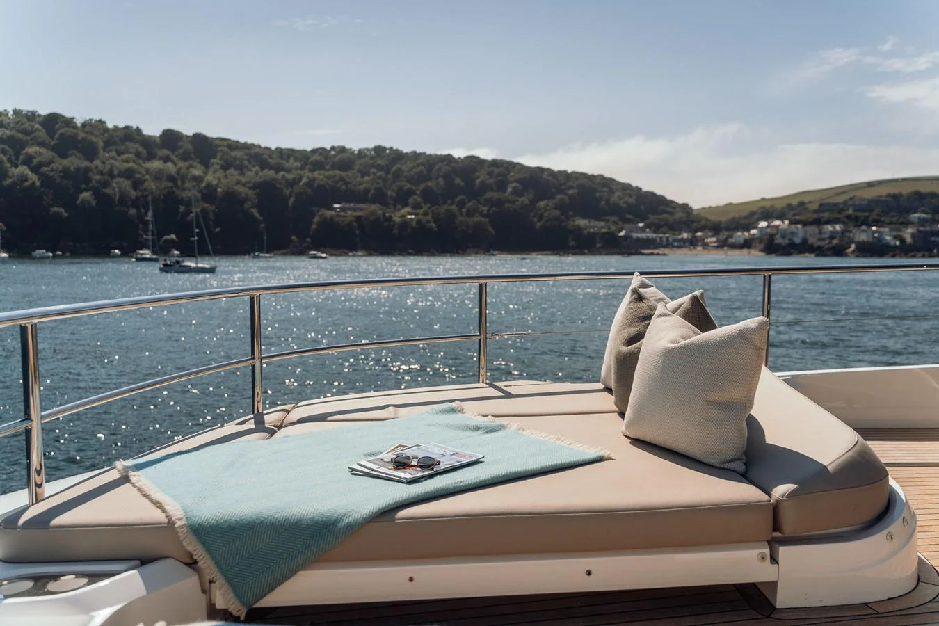 The sundeck offers a luxurious lounging area with plush cushions and a serene view of the water. aboard CHASE Yacht for Sale