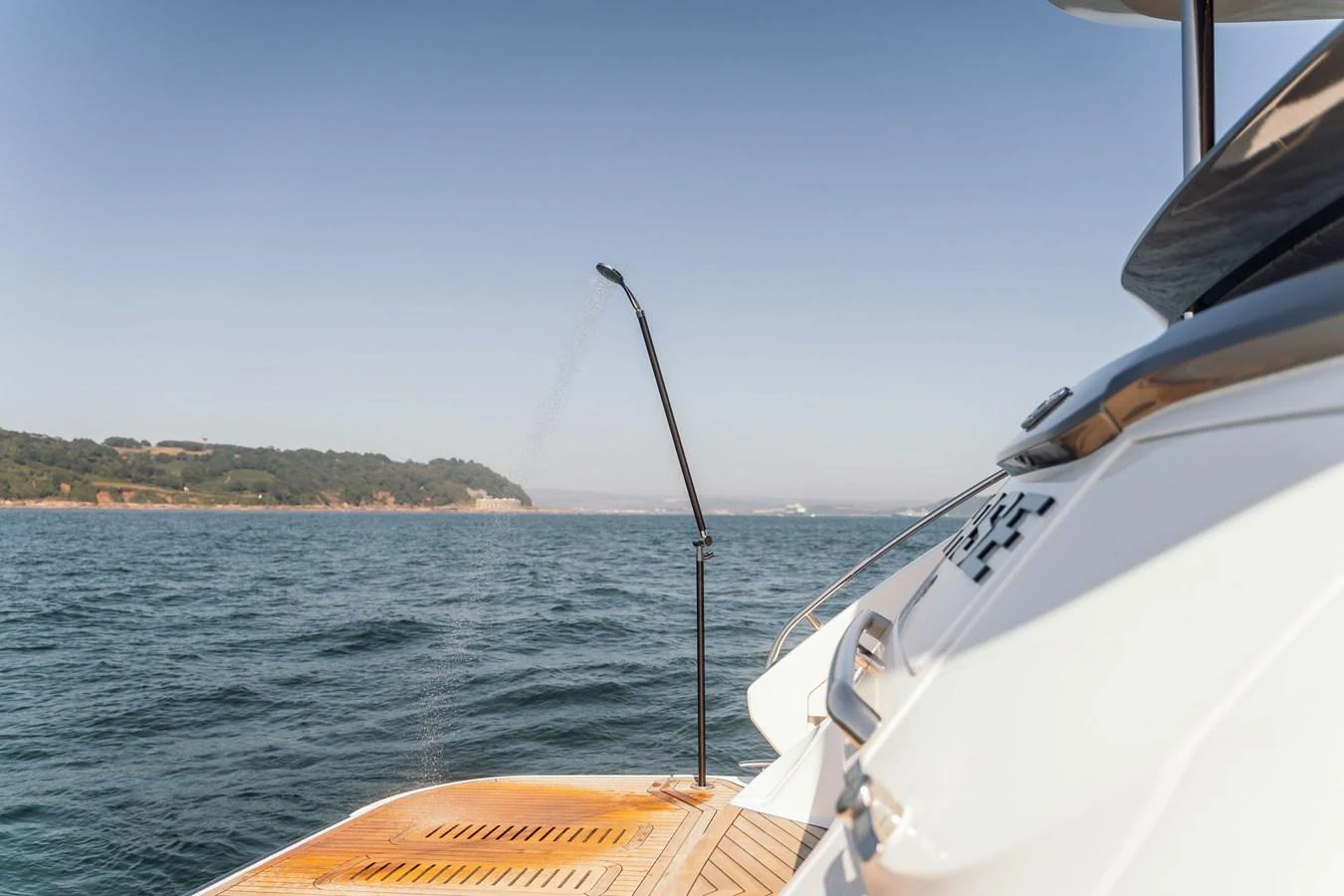 The yacht's swim platform offers easy access to the water with a sleek, modern design. aboard CHASE Yacht for Sale