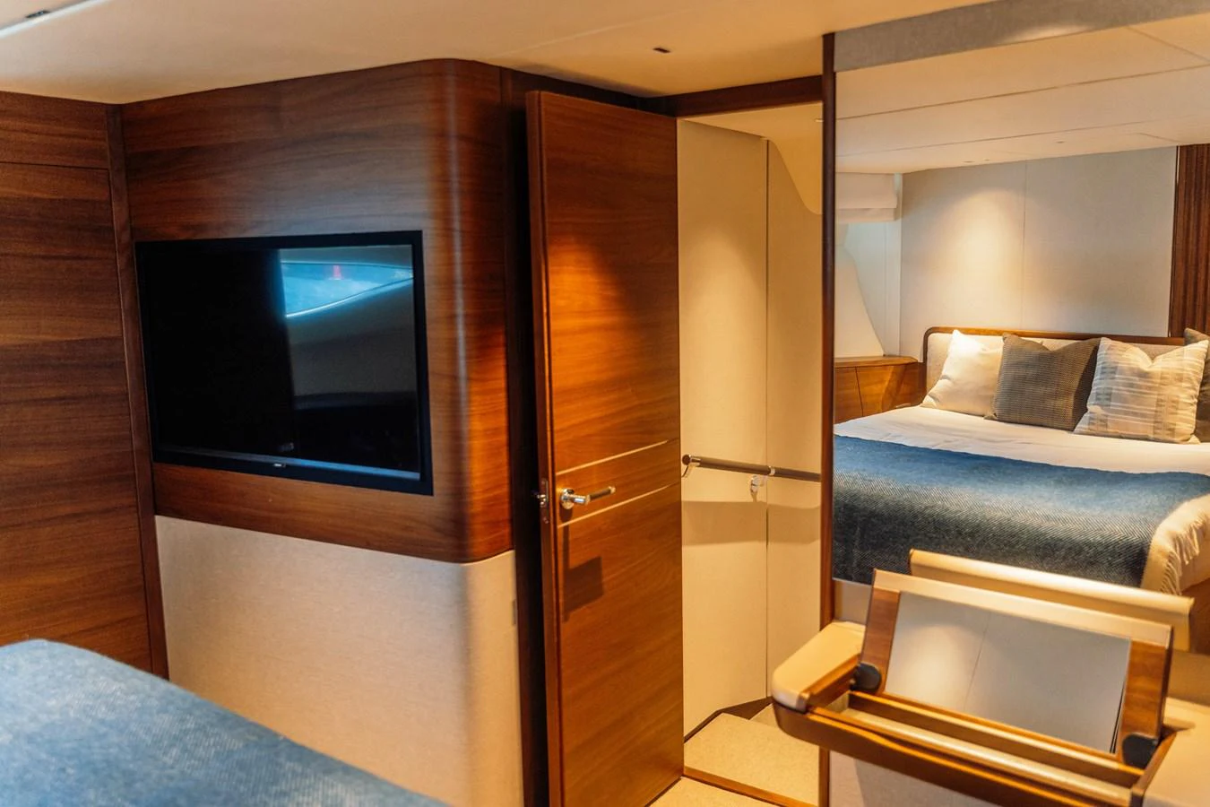 A cozy stateroom with a comfortable bed and a flat-screen TV. aboard CHASE Yacht for Sale