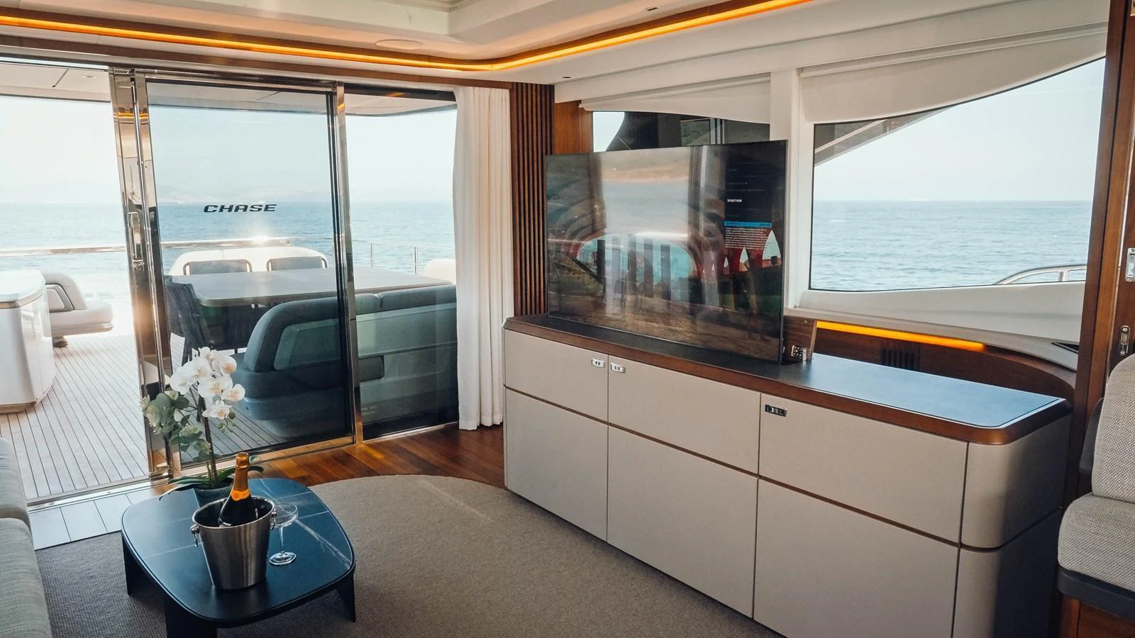 The salon offers a luxurious and comfortable space with a stunning view of the sea. aboard CHASE Yacht for Sale