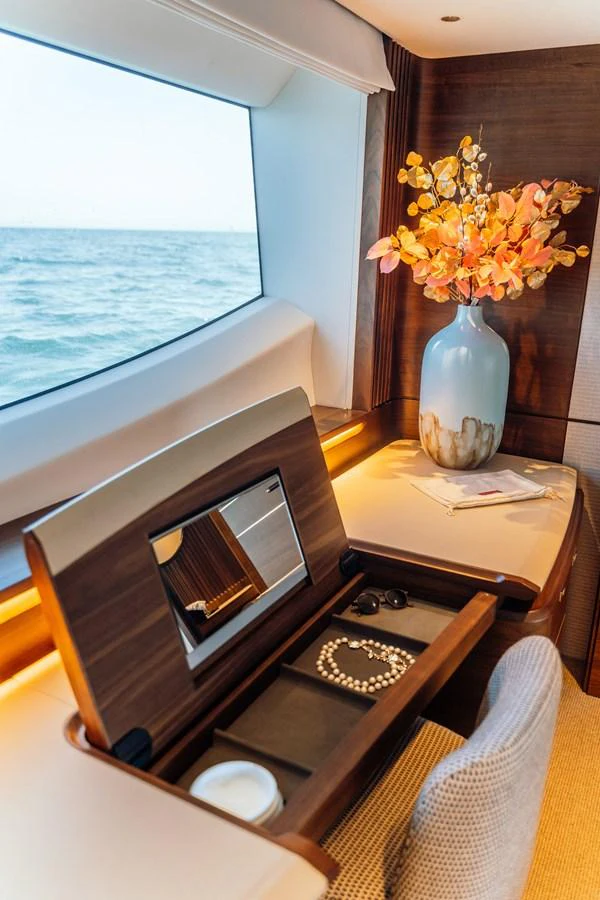 A stylish vanity area with a large window offering a stunning ocean view. aboard CHASE Yacht for Sale