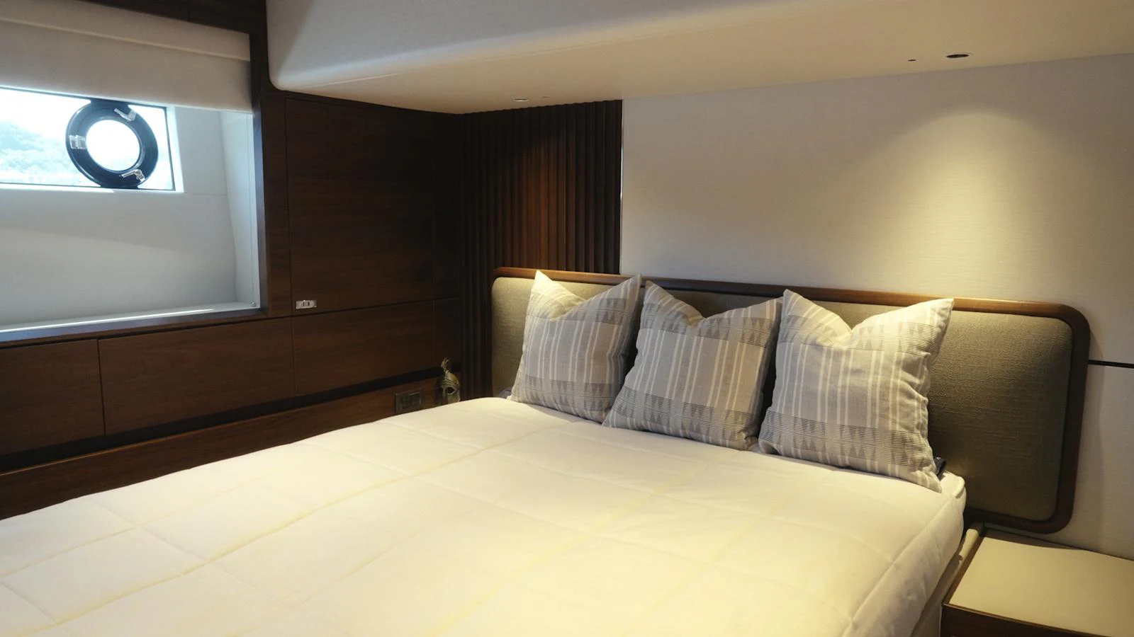 A cozy stateroom featuring a comfortable bed with plush pillows. aboard CHASE Yacht for Sale