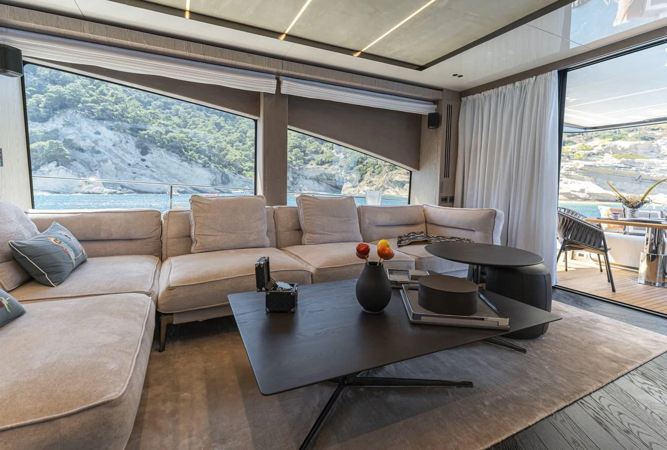 The salon offers a luxurious and comfortable seating area with panoramic views of the surrounding waters. aboard ORCA I Yacht for Sale