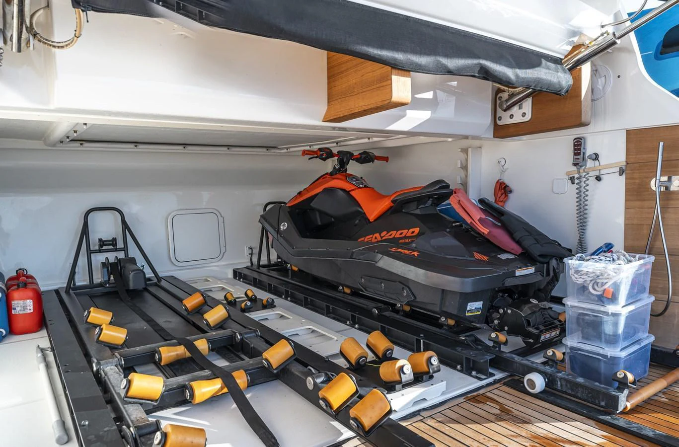 The yacht features a well-equipped garage with a personal watercraft and storage space. aboard ORCA I Yacht for Sale