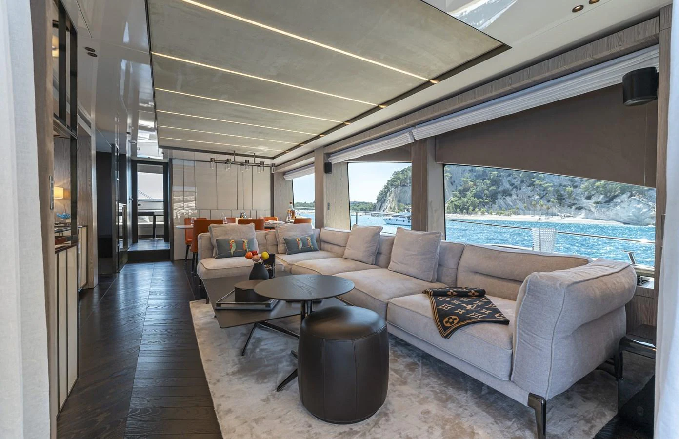 The spacious salon features luxurious seating with panoramic views of the sea. aboard ORCA I Yacht for Sale