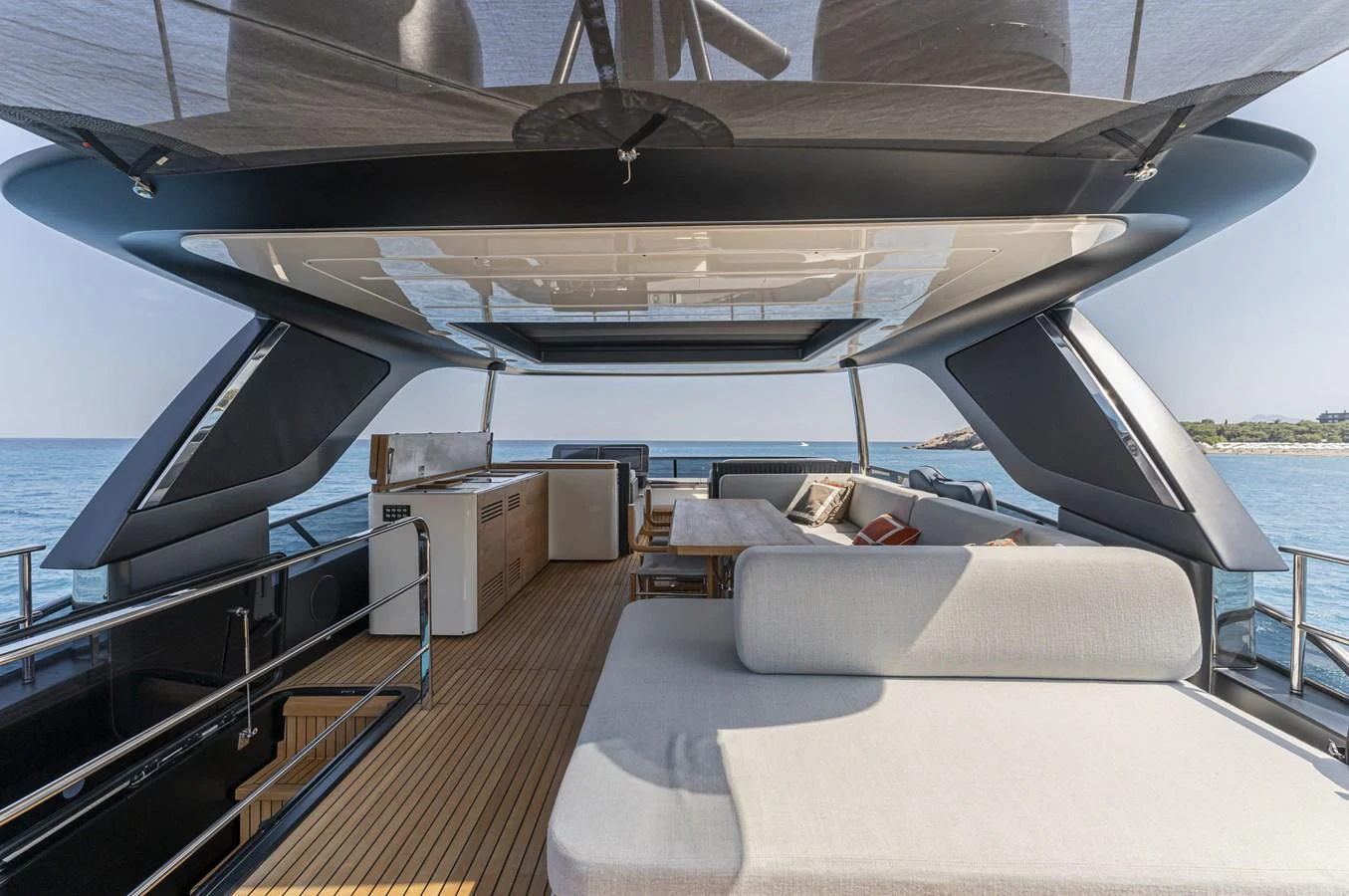 The flybridge offers a spacious and luxurious area for relaxation and entertainment with stunning sea views. aboard ORCA I Yacht for Sale