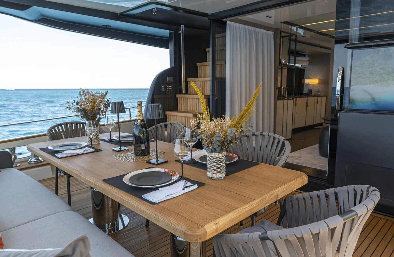 An elegant dining area on the yacht offers a perfect setting for a meal with a view of the sea. aboard ORCA I Yacht for Sale