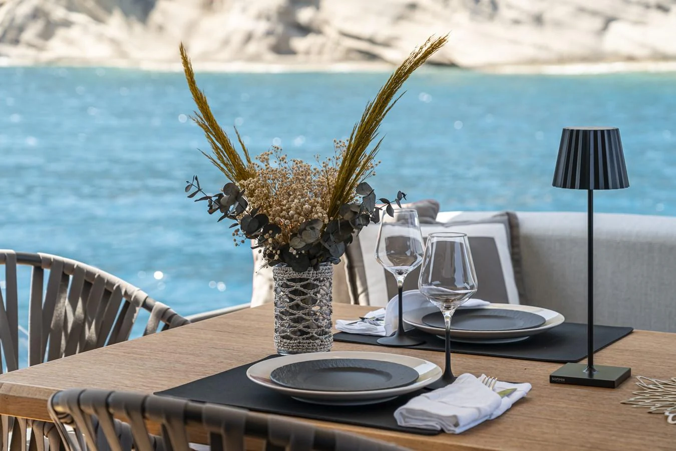 An elegant alfresco dining setup with a stunning ocean view. aboard ORCA I Yacht for Sale