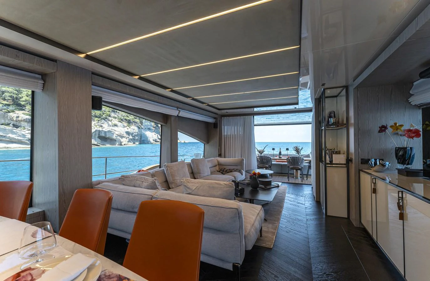 The yacht's salon offers a luxurious and spacious area with comfortable seating and stunning views of the sea. aboard ORCA I Yacht for Sale