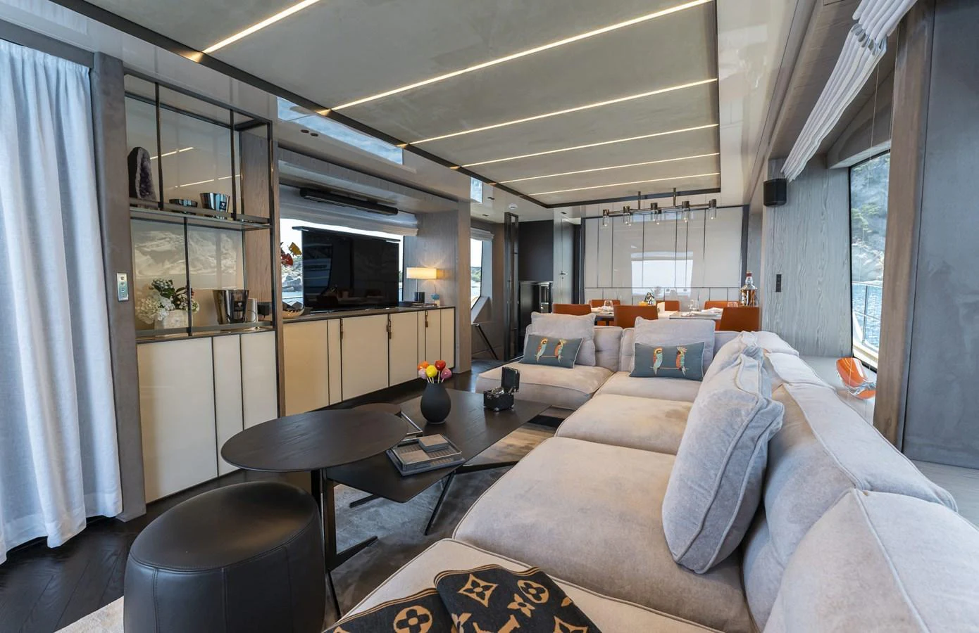The salon features a spacious and modern design with luxurious seating and elegant decor. aboard ORCA I Yacht for Sale