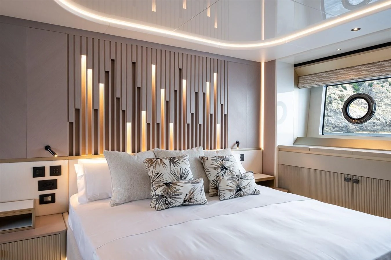 A luxurious stateroom featuring a large bed with elegant decor and ample natural light. aboard 82 OCEAN ENCLOSED Yacht for Sale