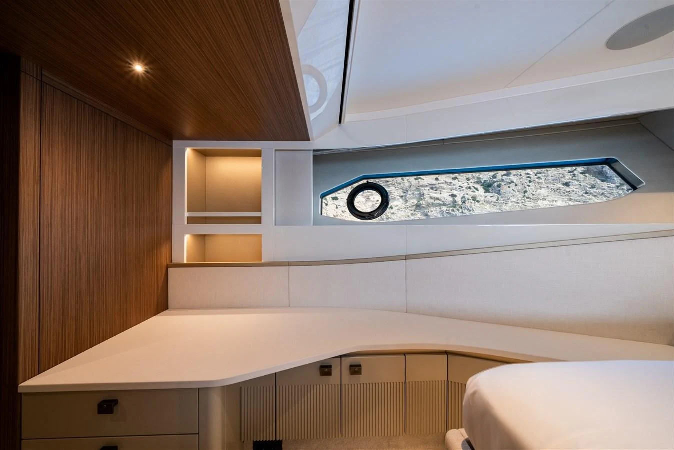 The stateroom features a sleek, modern design with ample natural light and elegant wood finishes. aboard 82 OCEAN ENCLOSED Yacht for Sale