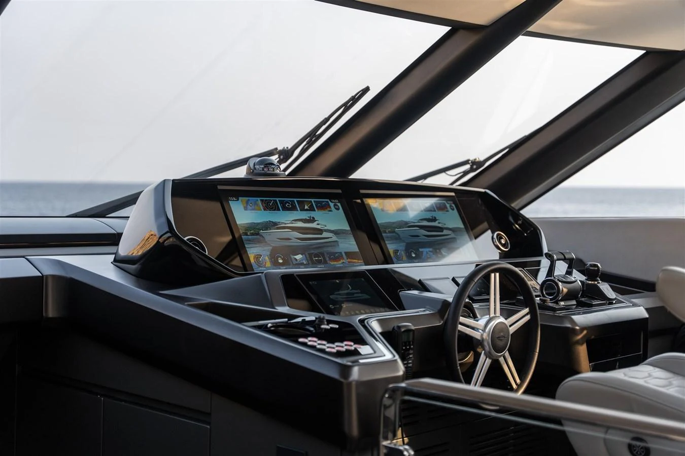 The helm station features advanced navigation equipment and luxurious seating, offering a commanding view of the sea. aboard 82 OCEAN ENCLOSED Yacht for Sale