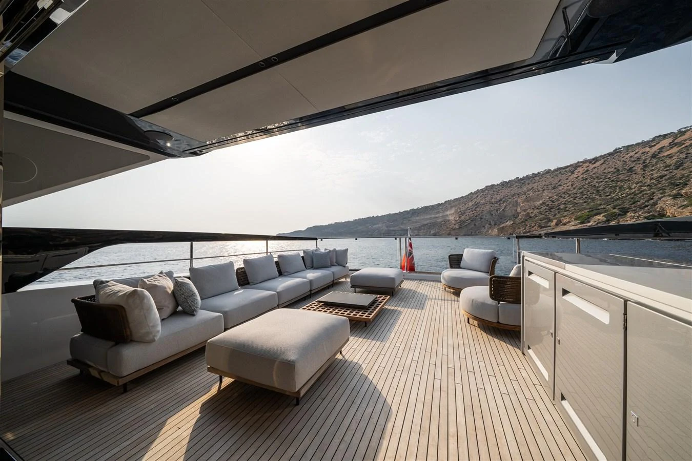 The spacious aft deck offers luxurious seating with stunning views of the surrounding waters. aboard 82 OCEAN ENCLOSED Yacht for Sale