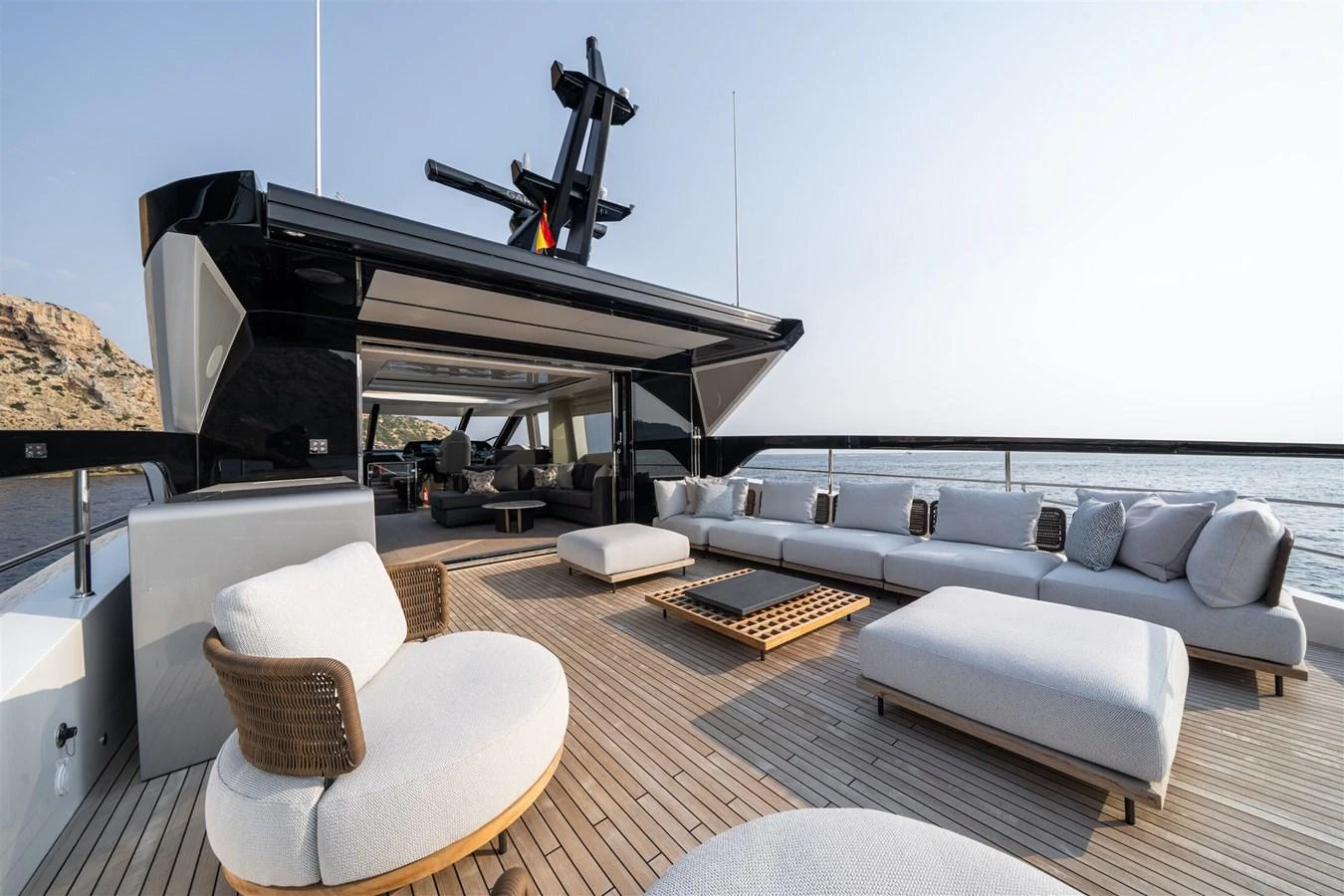 The spacious aft deck offers luxurious seating with stunning ocean views. aboard 82 OCEAN ENCLOSED Yacht for Sale