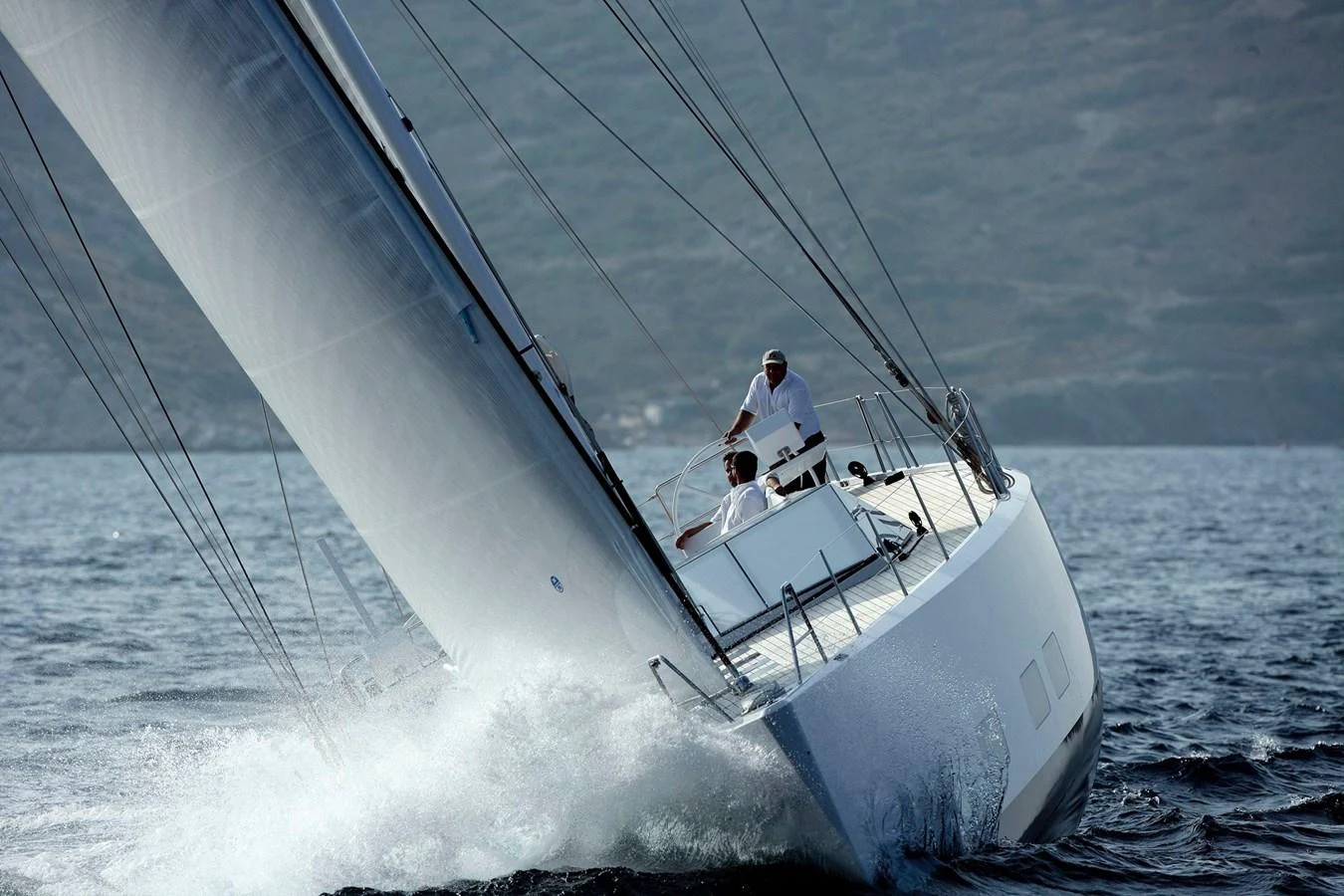 A sleek sailing yacht cuts through the water with its sails fully deployed. aboard POLYTROPON II Yacht for Sale