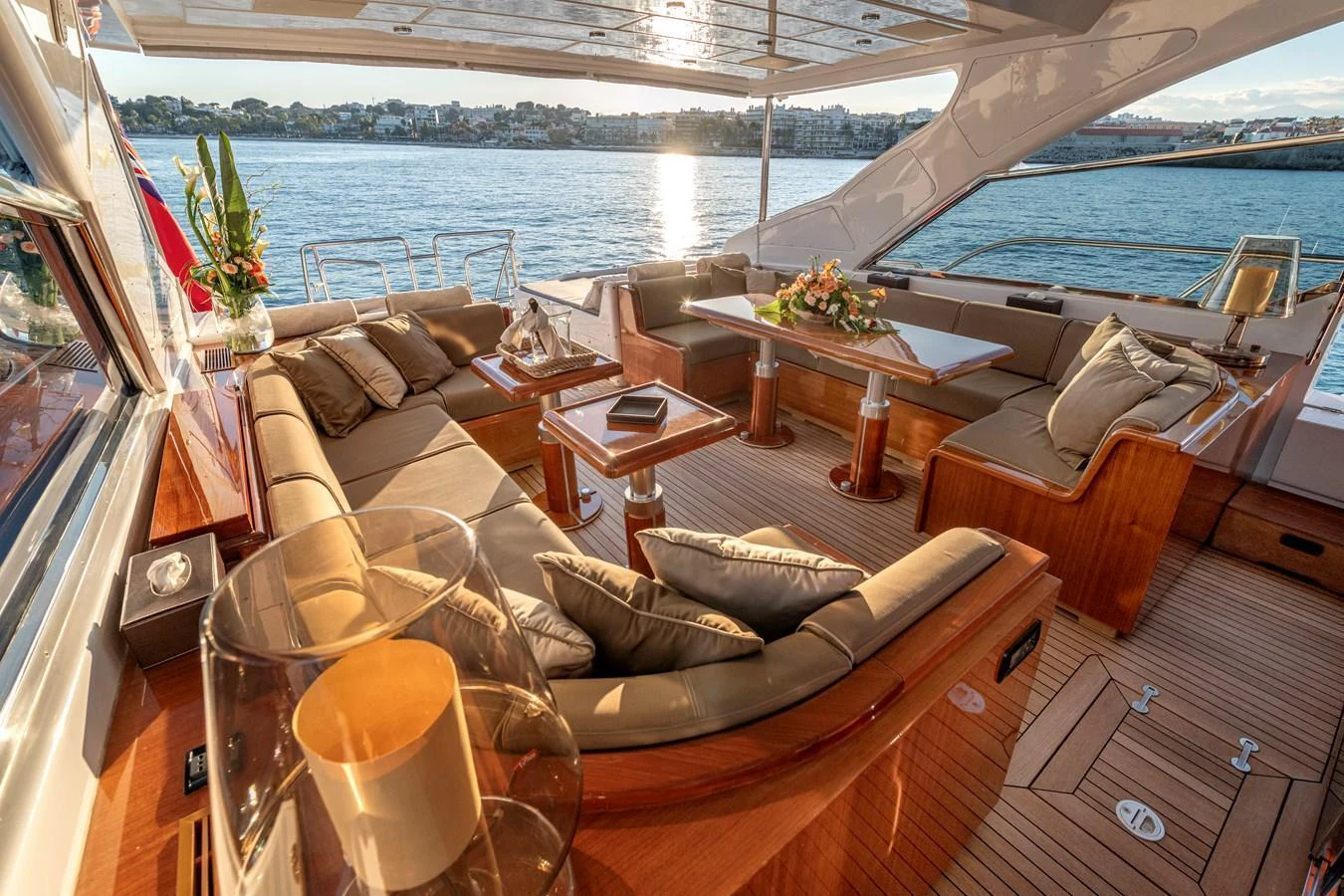 The aft deck offers a luxurious seating area with plush cushions and elegant wooden furnishings, perfect for enjoying the view. aboard K GRACE Yacht for Sale